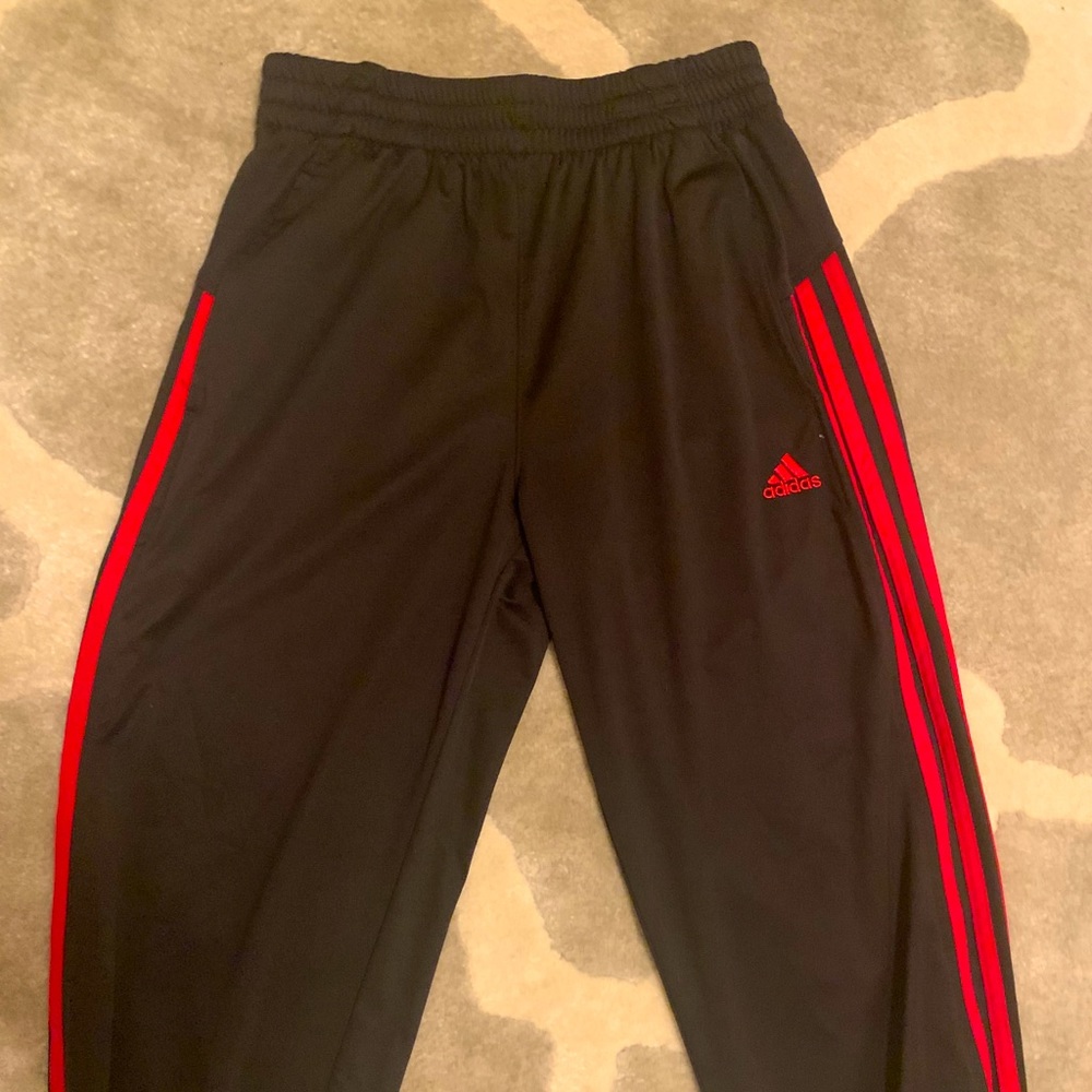 Black and red adidas pants